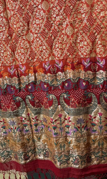 Piliya orange and red bandhani Dupatta odhna along with Meenakari and figure motives in the border