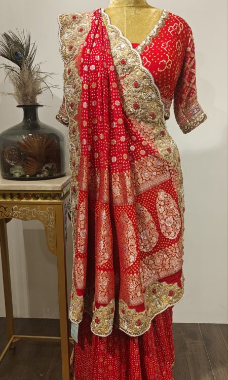 Red Blossom Bandhani Saree – Floral Zari Motifs with Heavy Zardozi Pallu