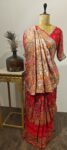 Where Meenakari meets mythology — this red Bandhani drape is a walk through a handwoven forest