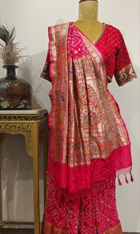 Gulzaar:-Pink Raidana Bandhani Saree with Multicolor Meenakari Floral along with Peacock and birds motifs.