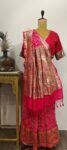 Gulzaar:-Pink Raidana Bandhani Saree with Multicolor Meenakari Floral along with Peacock and birds motifs.