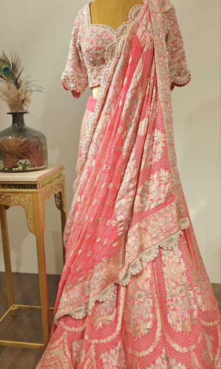 Gulabi Baag: Bandhani Lehenga with zardosi & Pearl-Adorned Blouse & Parsi Weave Dupatta.