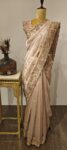Khusbhoo – Elegant Tissue Silk in Soft Peach with Regal Detailing