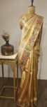 Golden Grace – Kanchi Saree with Intricate Floral Border