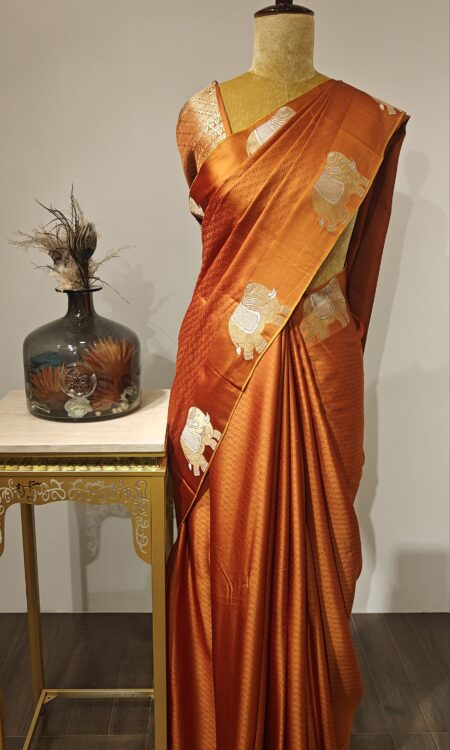 Terracotta Glow – Handwoven Satin Silk with Royal Motifs
