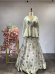 Pastel Petals: Mint Green Embroidered Lehenga with Sheer Peplum