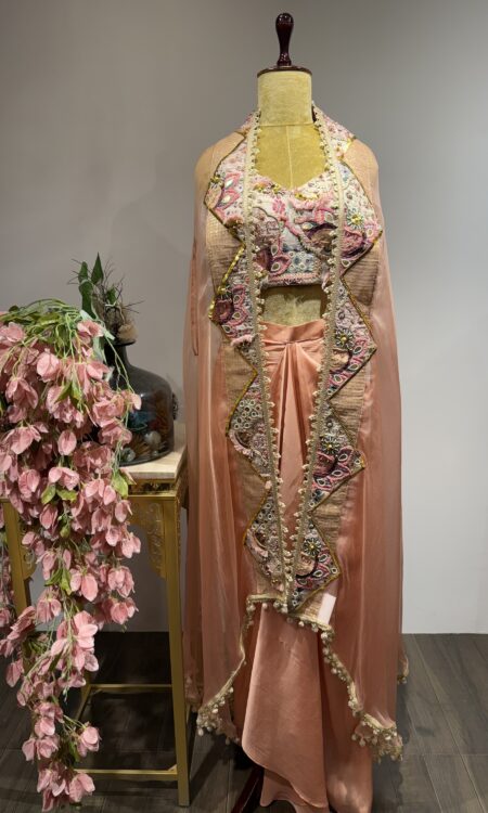 Tassel Tale: Peach Drape Skirt Set with Luxe Embroidered Cape