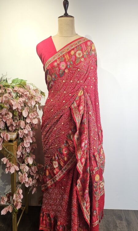 Red colour bandhani saree with floral border