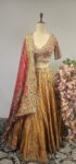 Gold Tissue lehanga with red blouse and bandhani duppatta