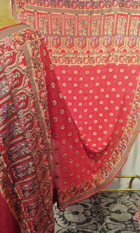 Red bandhani dupatta in maharaj maharani concept. (Odhana)