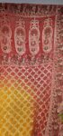 Red-yellow bandhani dupatta with doli baraat concept