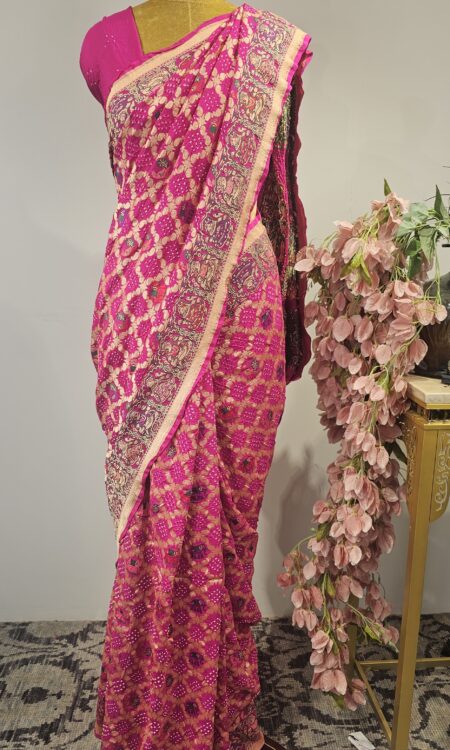 Pink bandhani saree with maharaja and maharani concept