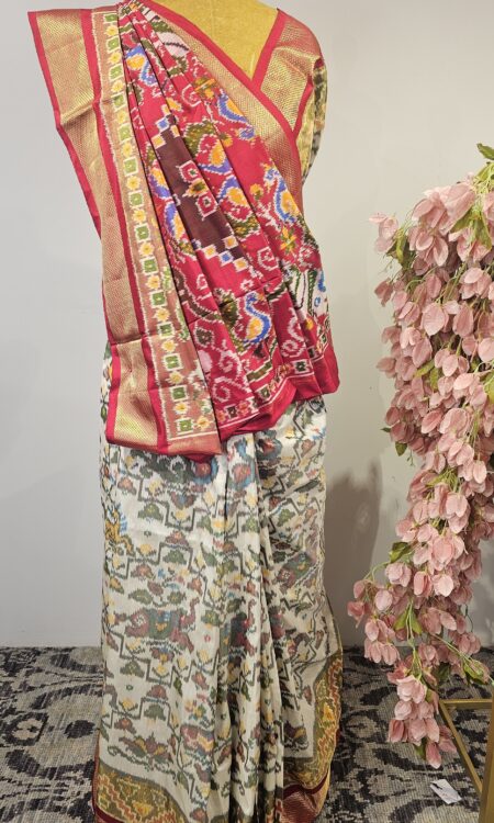 White Ikat saree with red blouse