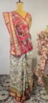 White Ikat saree with red blouse