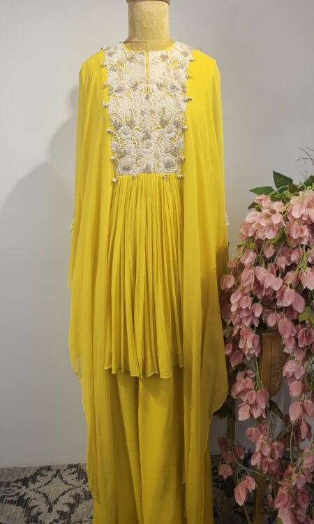 Lemon yellow cape top with flared pants