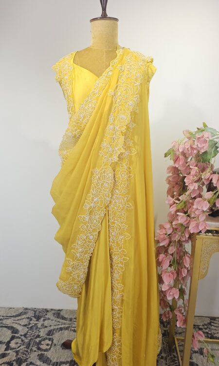Light yellow colour drape saree with cape style