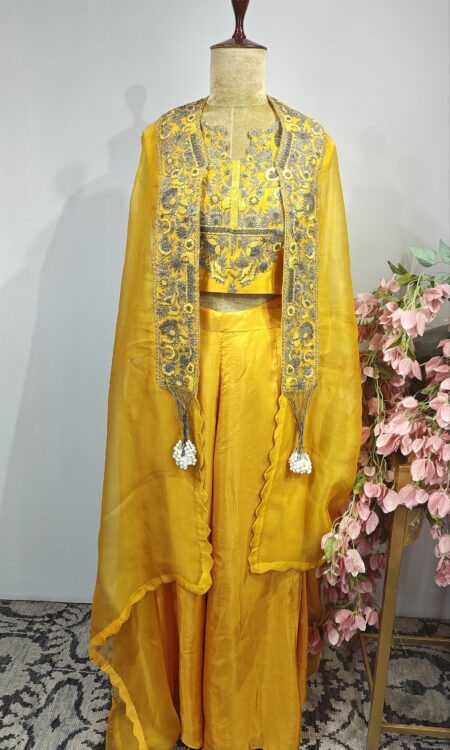 Yellow colour flared pants with cape and blouse