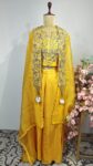 Yellow colour flared pants with cape and blouse