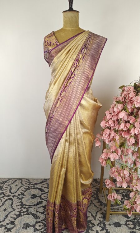 Gold saree with purple elephant border
