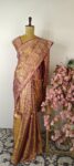 Gold color Kanchi silk saree with purple zari border