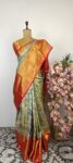 Sage green Kanchi silk saree with red zari border