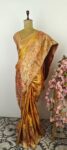 Gold color Kanchi saree with orange border