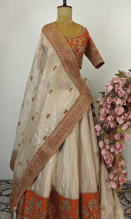 Ivory and orange Hand embroidered tissue Lehenga Set with rust Kesariya border
