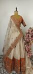 Ivory and orange Hand embroidered tissue Lehenga Set with rust Kesariya border