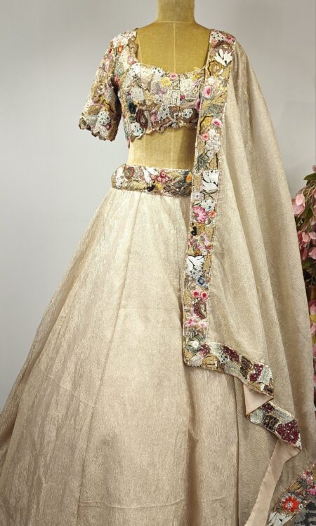 Multi colour embroidered blouse with beige crushed tissue lehenga