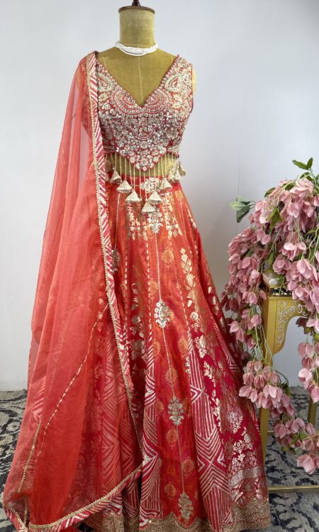 Orange colour Banarasi silk brocade lehenga