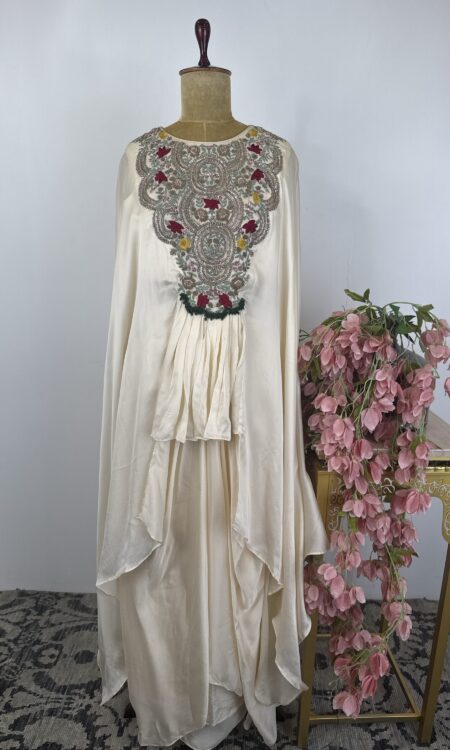 Off white colour cape style top with flared pants