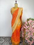 Yellow to orange bandhani saree