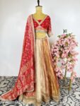 Rust orange lehenga with Bandhani pilia dupatta