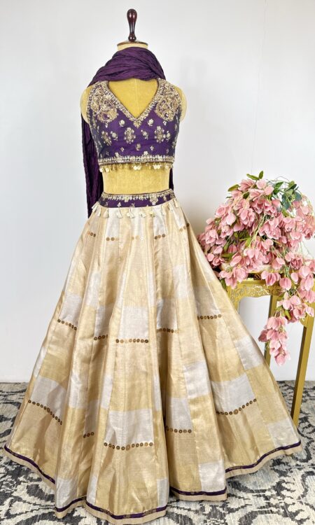 Gold and silver tissue lehenga with purple colour blouse