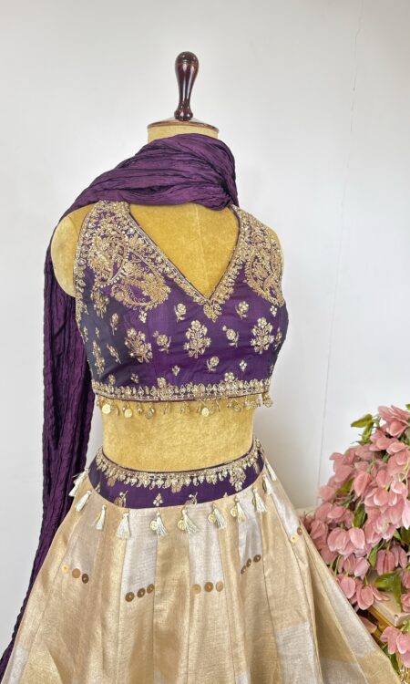 Gold and silver tissue lehenga with purple colour blouse