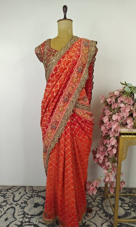 Red-orange pre drape saree with stitched blouse