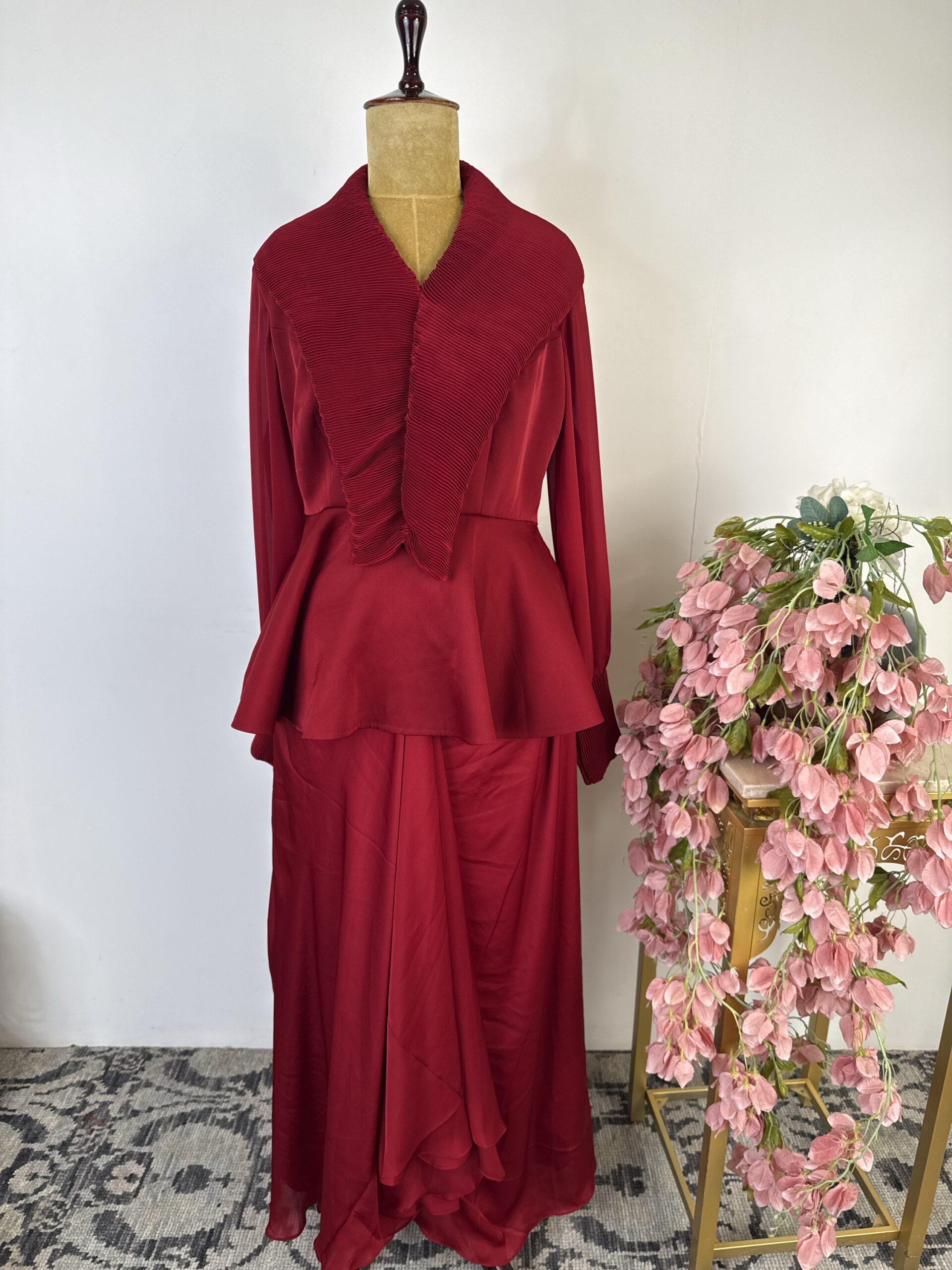 Red colour peplum top with drape skirt