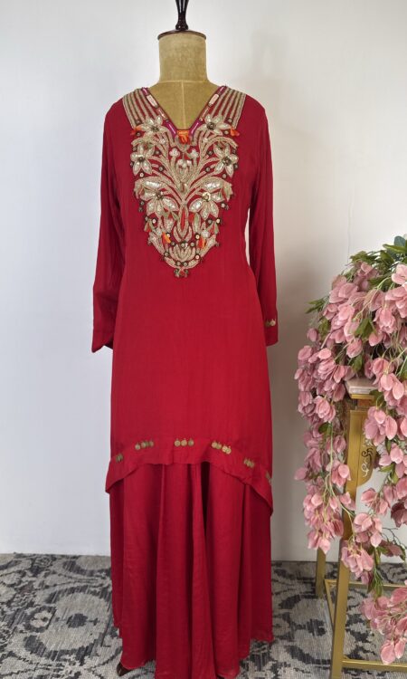 Red colour top with flared pants