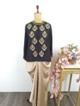 Black top with gold drape skirt