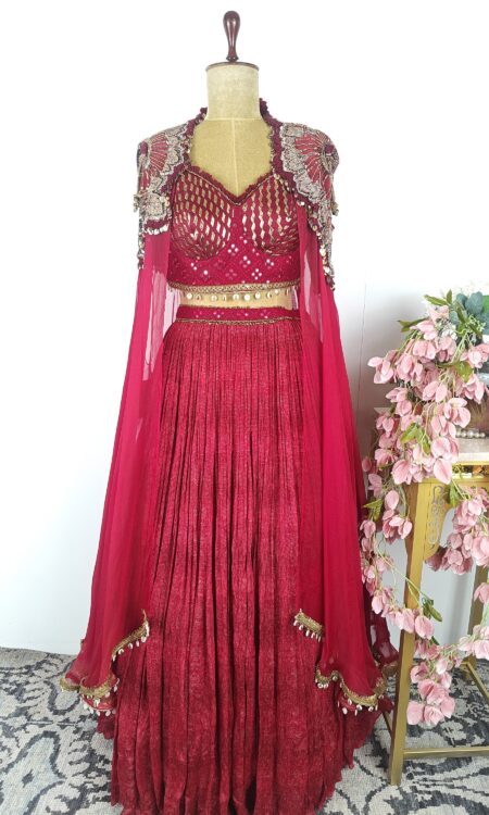 Red colour corset and skirt with cape
