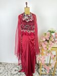 Red colour drape skirt with shells cape