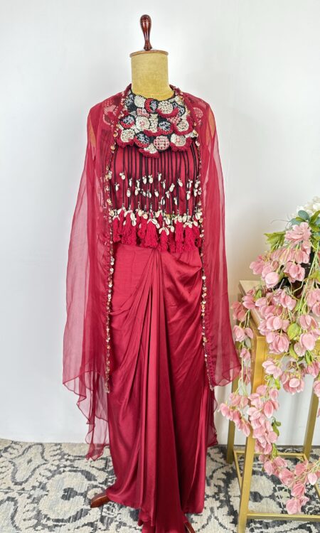 Red colour drape skirt with shells cape